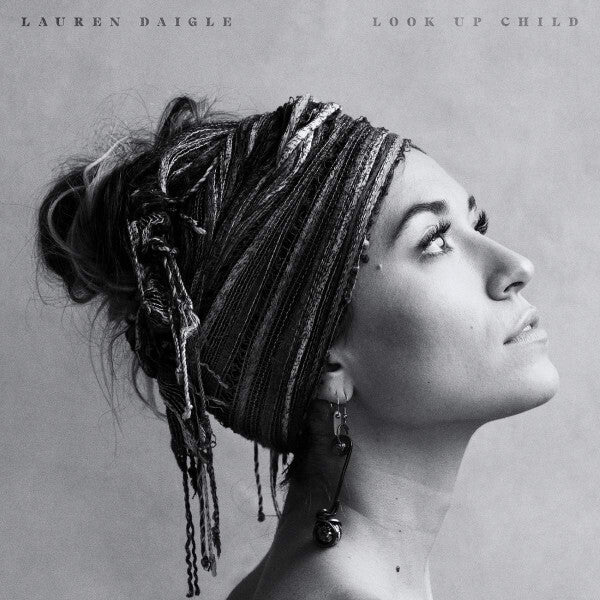 Black and white vinyl record cover featuring a woman in profile with a patterned headwrap.
