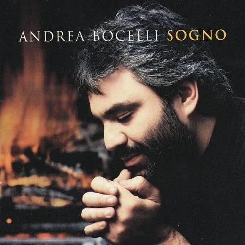 Andrea Bocelli Sogno album cover with contemplative portrait by a fireplace
