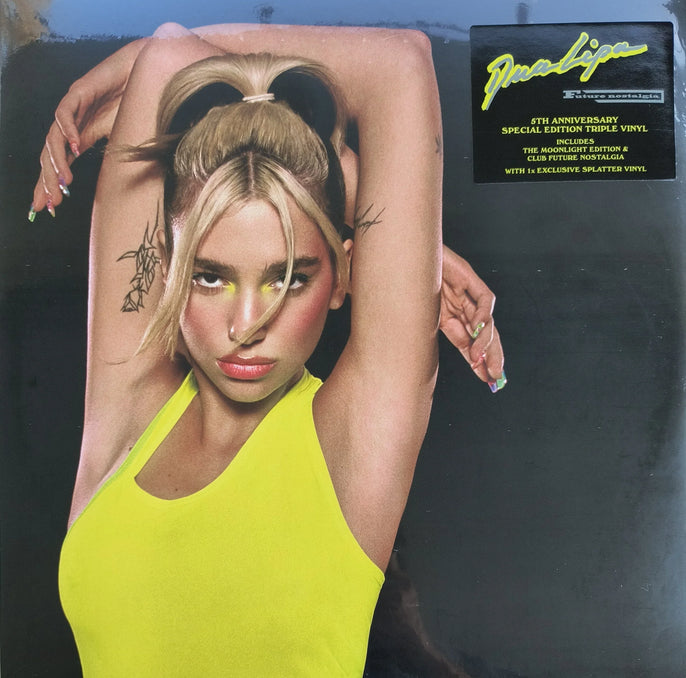 Colorful vinyl record cover featuring a woman in a yellow tank top with arm tattoos, posing against a black background, special edition music album.