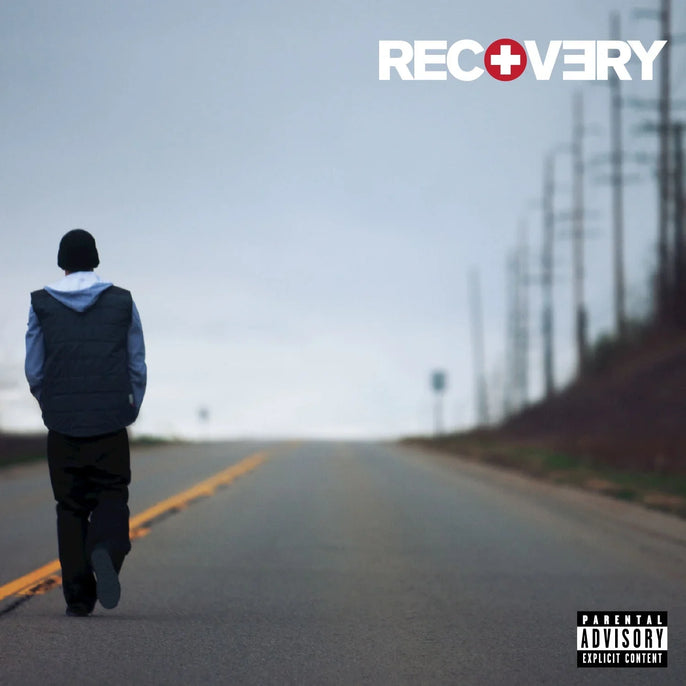 Vinyl record cover showing person walking alone on road with Recovery album title and advisory label.