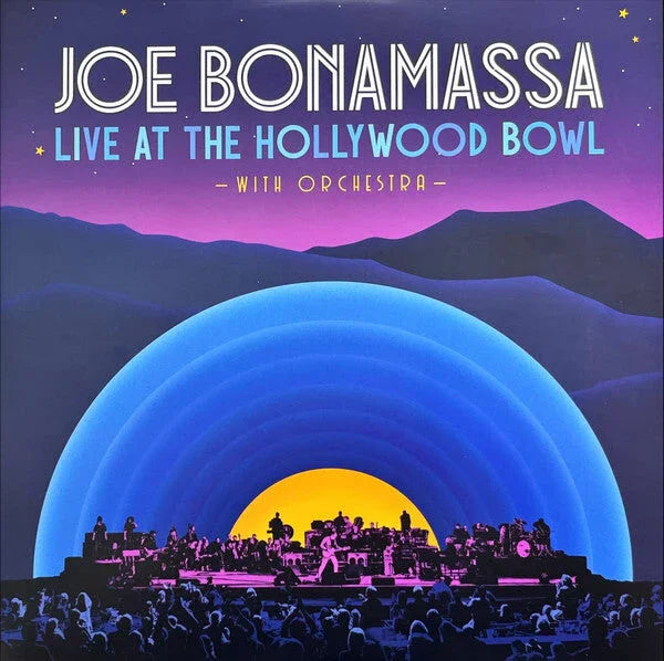 Poster for "Joe Bonamassa Live at the Hollywood Bowl with Orchestra" featuring a stylized stage, audience, and mountains in purple, blue, and yellow tones.