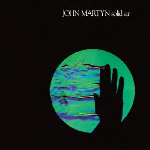 John Martyn Solid Air vinyl album cover with black background and a green-blue circular design featuring a silhouetted hand.