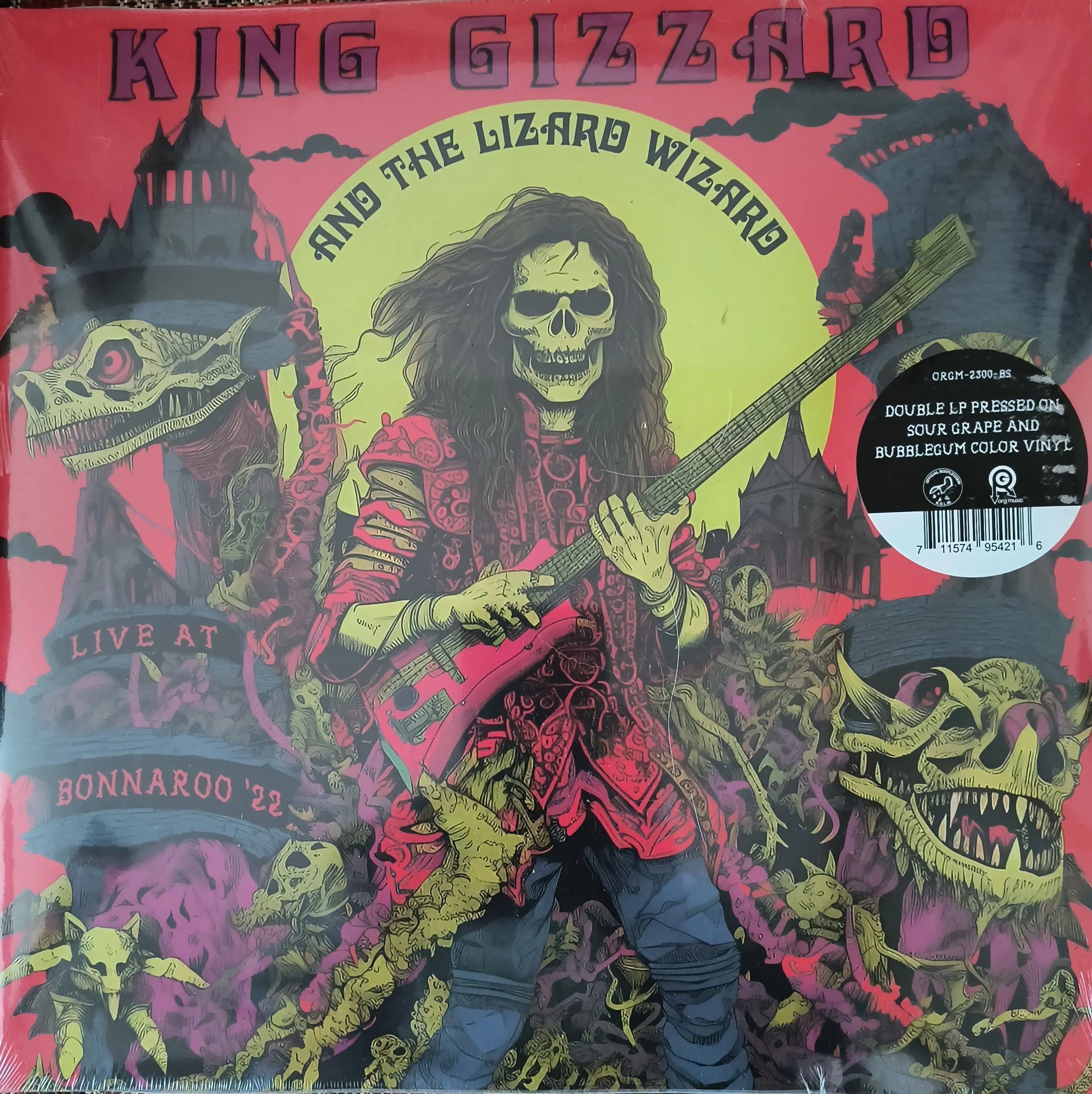 Illustrated album cover for King Gizzard & the Lizard Wizard, featuring a skeleton playing a guitar amid monsters, with "Live at Bonnaroo '22" and album details visible.