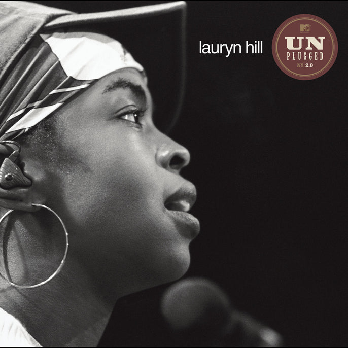 Black and white album cover showing a woman in profile with a headscarf and hoop earring, microphone in foreground, text reads 'lauryn hill' and 'MTV Unplugged No. 2.0'.