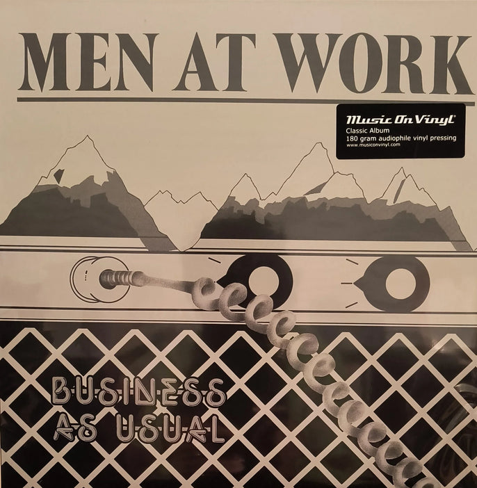 Men At Work Business As Usual vinyl record cover with mountains, audio jack, and black grid