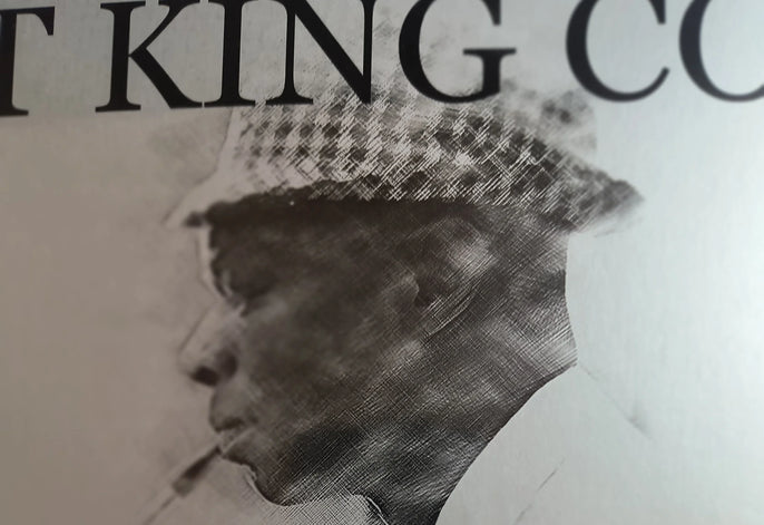 Vintage vinyl record cover with monochrome portrait of a man in a patterned hat