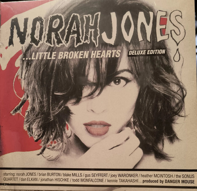 Norah Jones Little Broken Hearts Deluxe Edition album cover with bold text and artistic portrait