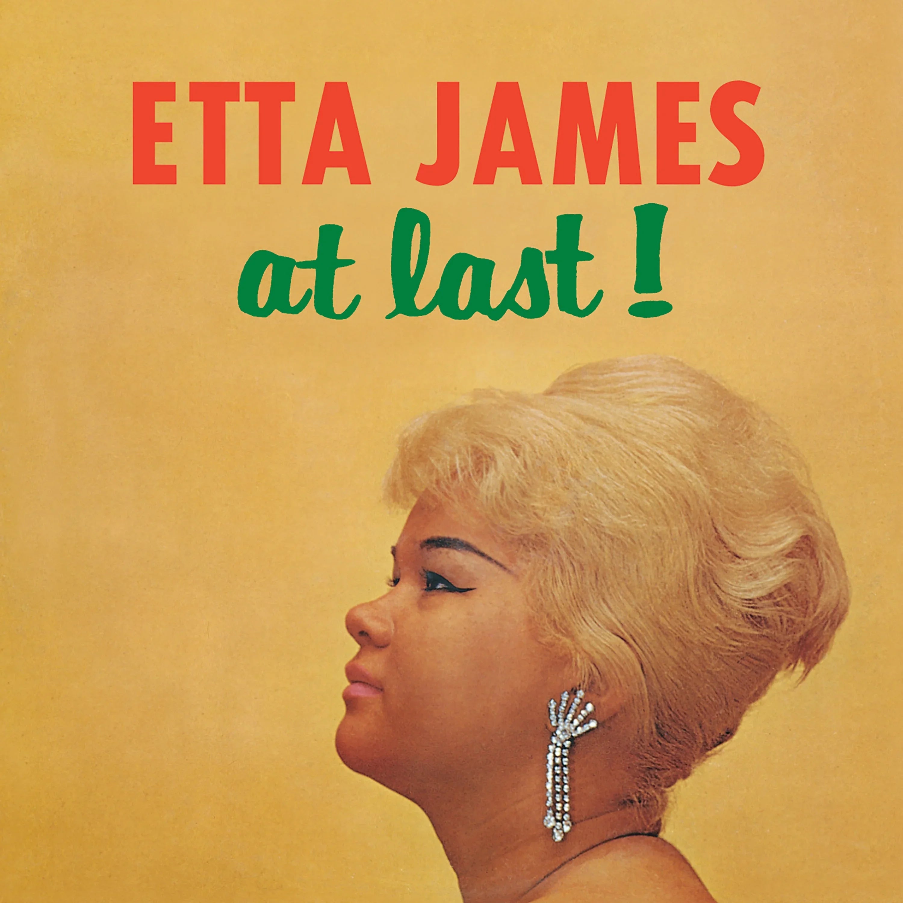 Profile photo of a woman with short blonde hair and bejeweled earrings against a yellow background, with bold red and green text reading "ETTA JAMES at last!" above her head.