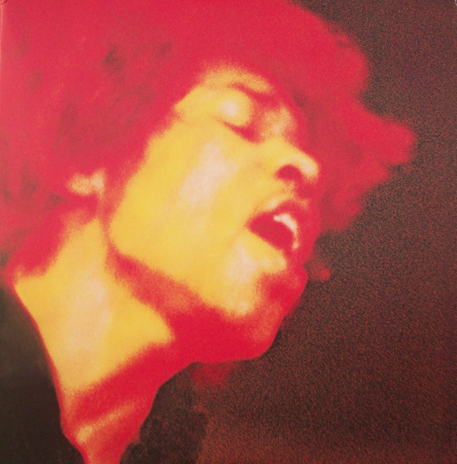 A person with closed eyes and open mouth is shown in a close-up, with red and yellow hues surrounding their face and hair, creating a dramatic, artistic effect.