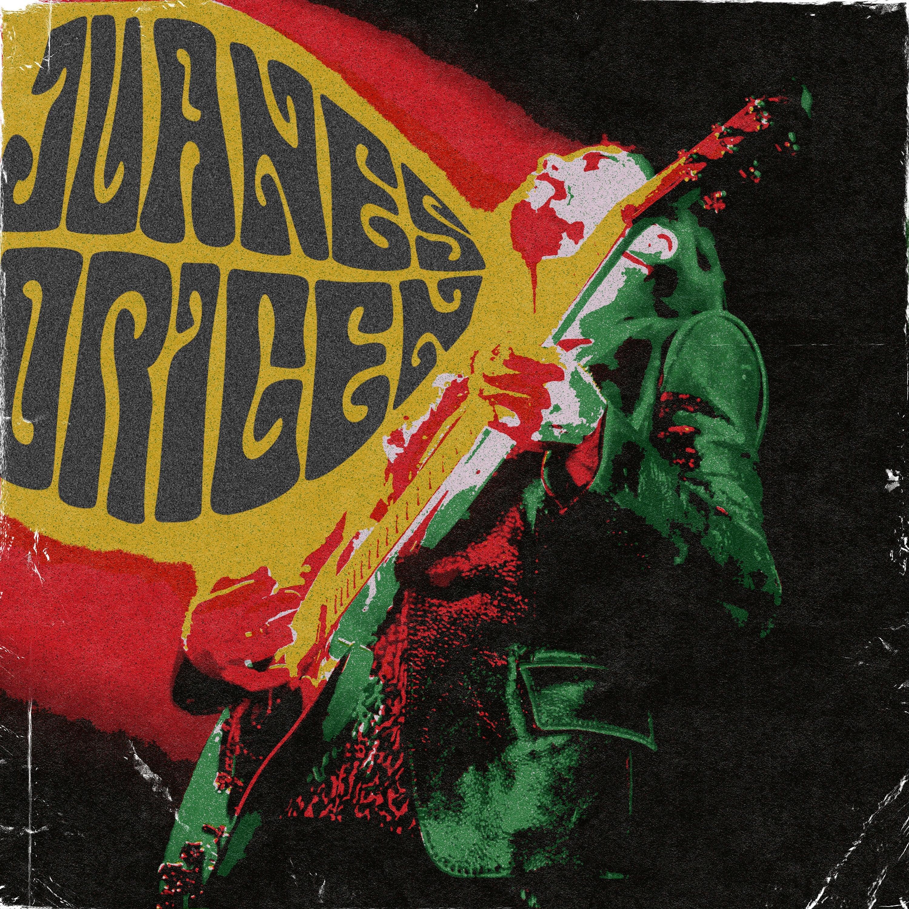 A person playing electric guitar is positioned in front of large, stylized text reading "JUANES ORIGEN" with a distressed, vintage effect.