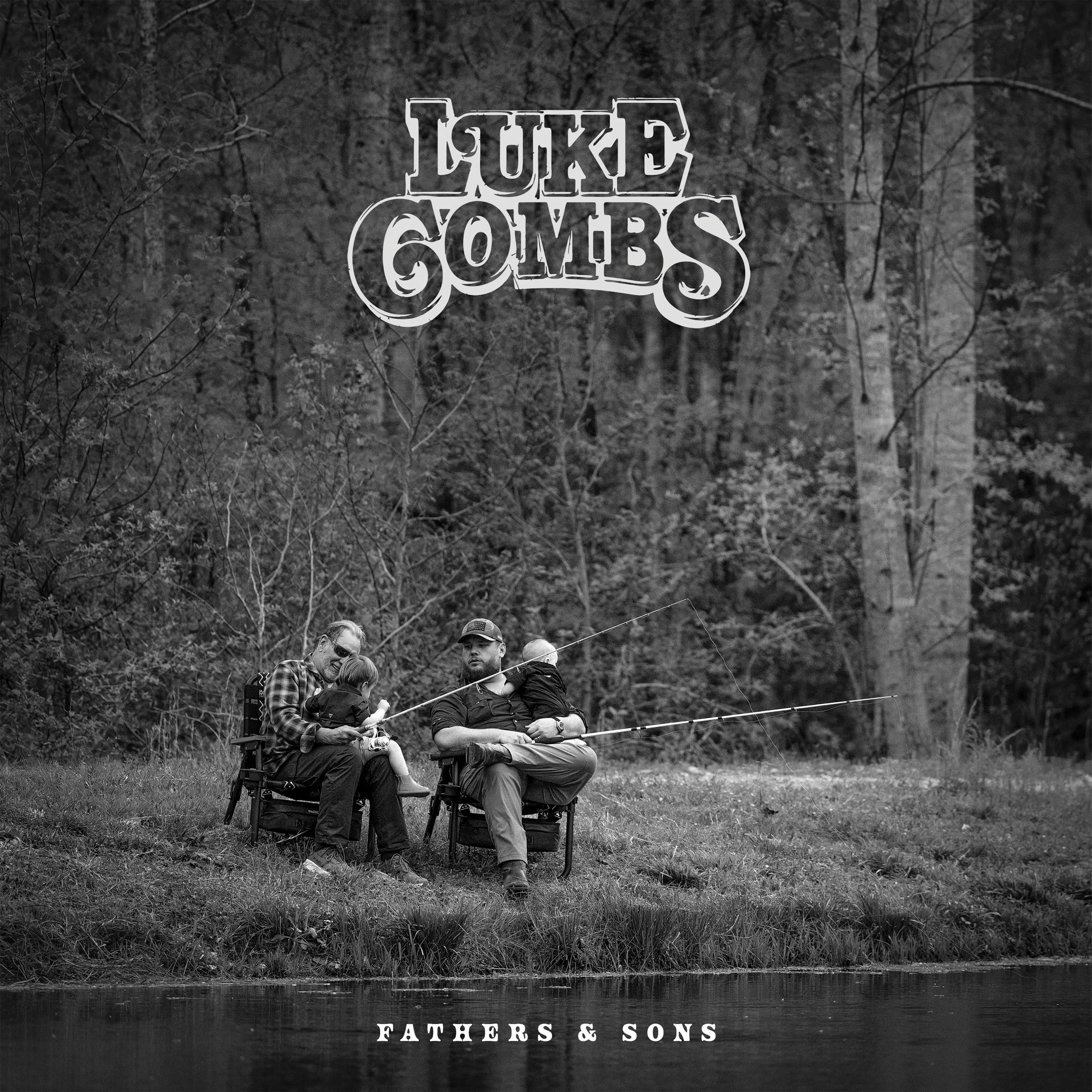 A black-and-white photo shows two men and two boys sitting by a pond fishing. The text "LUKE COMBS" is at the top and "FATHERS & SONS" is at the bottom.