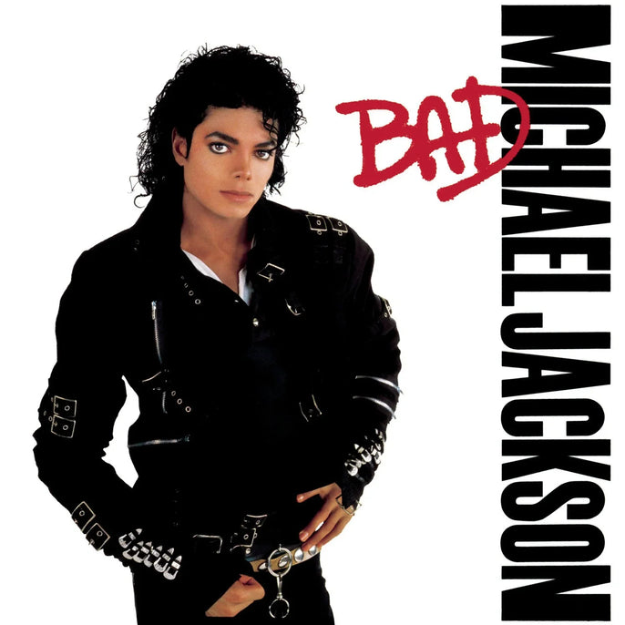 Vinyl album cover with a person in a black leather jacket, bold text reading BAD and MICHAEL JACKSON.