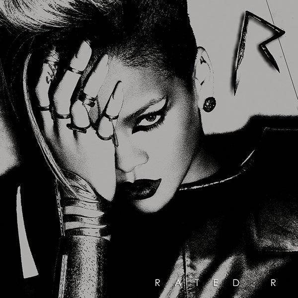 Monochrome vinyl record cover featuring a woman with dramatic makeup and bold accessories.