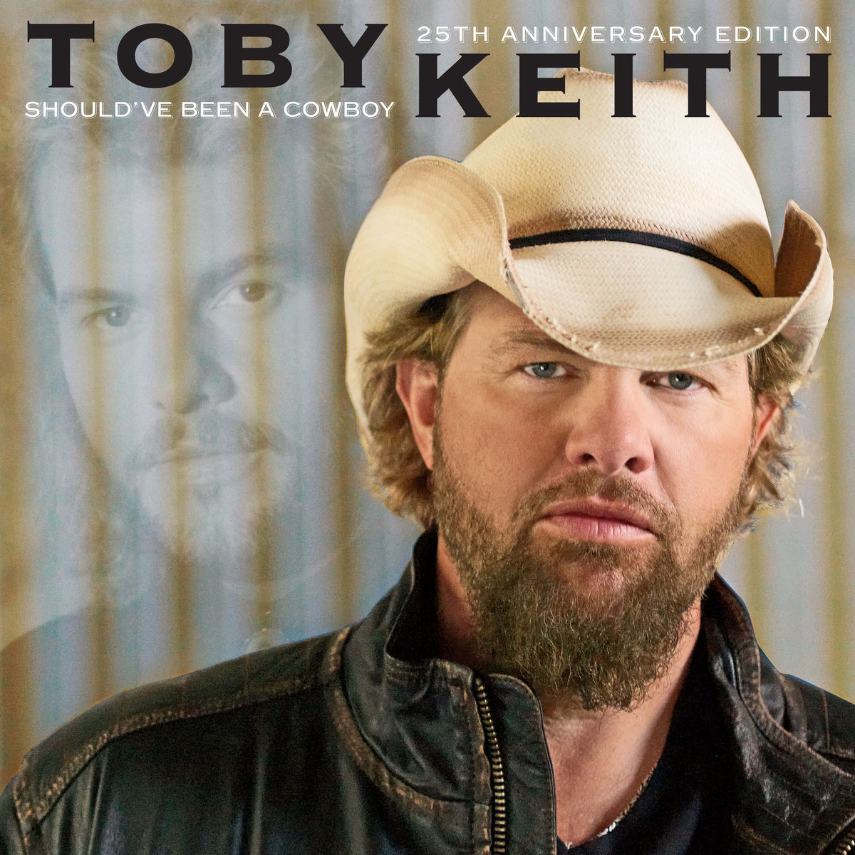 Album cover for Toby Keith's "Should've Been a Cowboy 25th Anniversary Edition," featuring Toby Keith in a cowboy hat and leather jacket with a faded image of his younger self in the background.