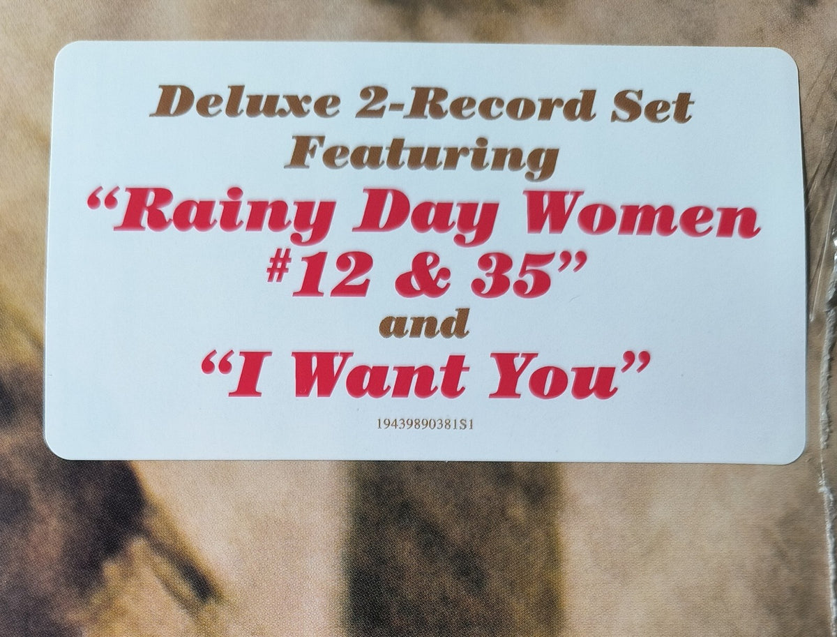 Deluxe 2-record vinyl set featuring Rainy Day Women #12 & 35 and I Want You sticker label.