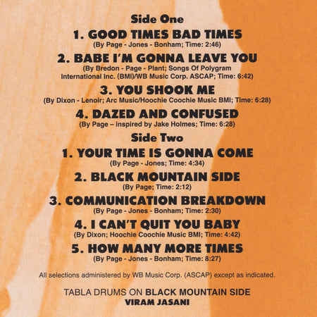 Vinyl record tracklist featuring classic rock songs with artist and song details on orange background