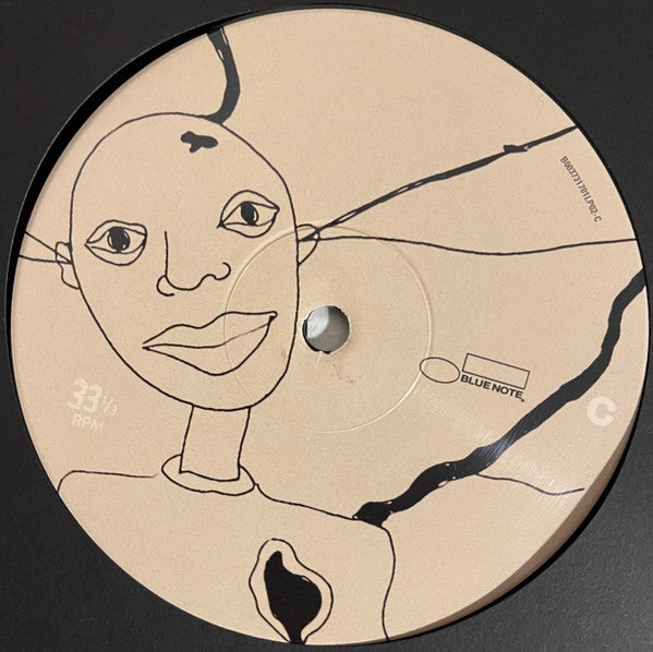 Vinyl record with minimalist line art face illustration, Blue Note label, 33 RPM collector item