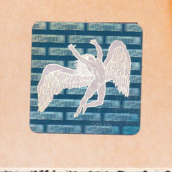 Sticker of winged figure with raised arms on a vinyl record sleeve, classic rock art design