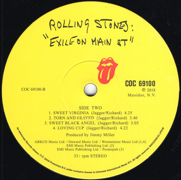 Yellow Rolling Stones 'Exile on Main St.' vinyl record label with tracklist and tongue logo.