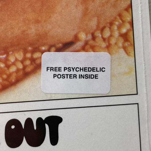 Sticker on vinyl record cover announcing free psychedelic poster inside
