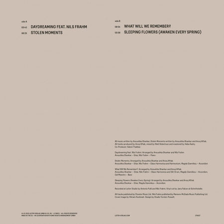 Minimalist vinyl record back cover listing track titles such as Daydreaming feat. Nils Frahm, Stolen Moments, What Will We Remember, and Sleeping Flowers, with credits on a beige background.