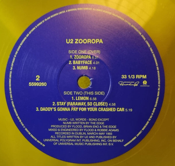 U2 Zooropa vinyl record label with tracklist on yellow vinyl, classic rock music collectible.