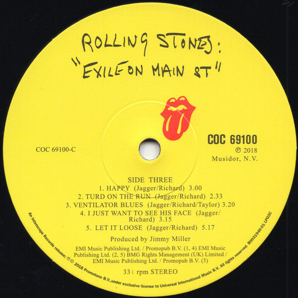 Rolling Stones Exile on Main St yellow vinyl record label with tongue logo and song list