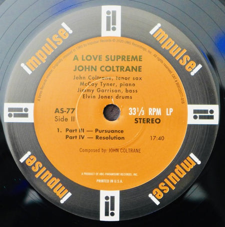 A Love Supreme John Coltrane vinyl record, Impulse! label, jazz album close-up.