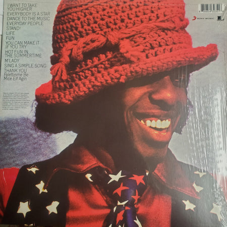 Smiling man in red crochet hat and star-patterned shirt, vinyl album cover, classic soul music