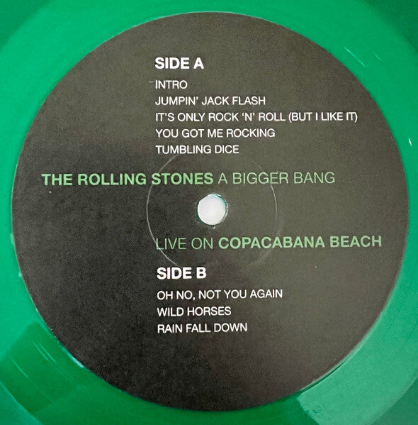 Green vinyl record labeled 'The Rolling Stones A Bigger Bang Live on Copacabana Beach'.