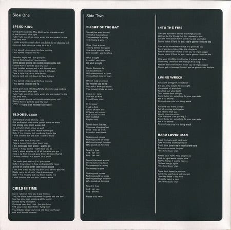 Vinyl record inner sleeve with printed song lyrics in white text on a dark background.