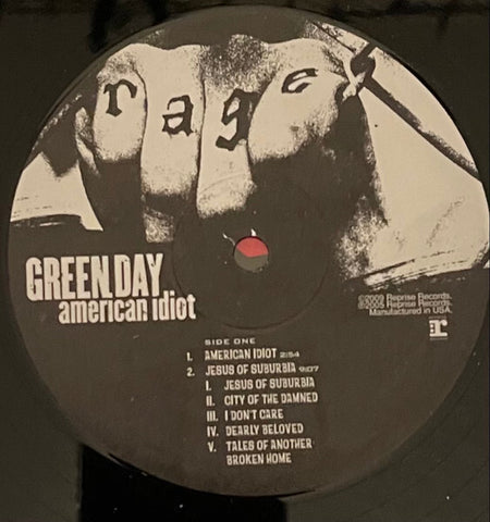 Green Day American Idiot vinyl record label with tracklist and a fist marked 'rage'