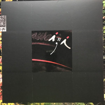 Minimalist black vinyl record cover with abstract red and white design and handwritten text
