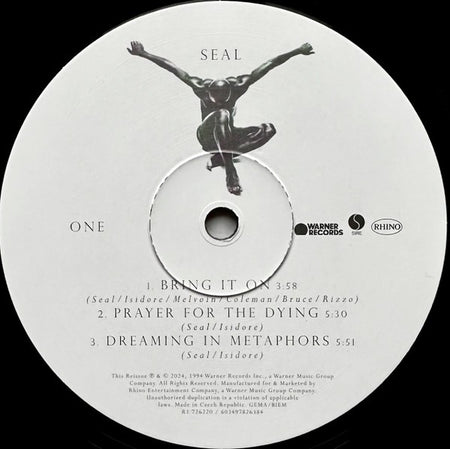 Seal vinyl record label with tracklist, black silhouette figure, Warner and Rhino logos