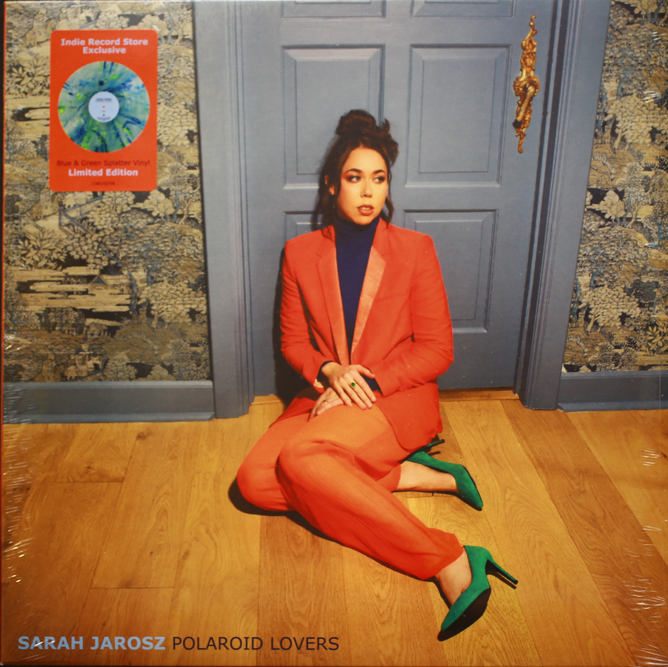 Sarah Jarosz Polaroid Lovers vinyl cover, woman in red suit on wood floor, indie record store exclusive.