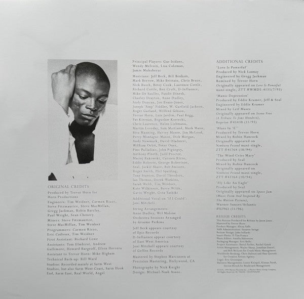 Monochrome album credits insert with black-and-white portrait of a man and detailed musician credits.