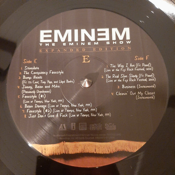Close-up of Eminem The Eminem Show Expanded Edition vinyl record with tracklist details.