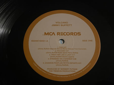Jimmy Buffett Volcano vinyl record on MCA Records, close-up of label with tracklist.