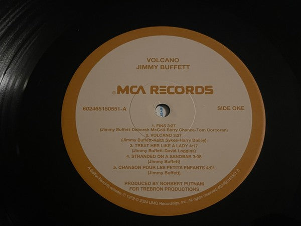 Jimmy Buffett Volcano vinyl record on MCA Records, close-up of label with tracklist.