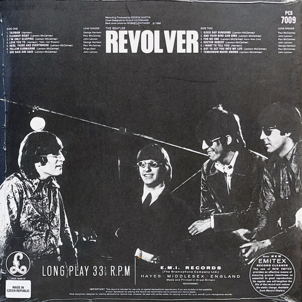 Black and white vinyl record cover for The Beatles Revolver showing band members and tracklist.