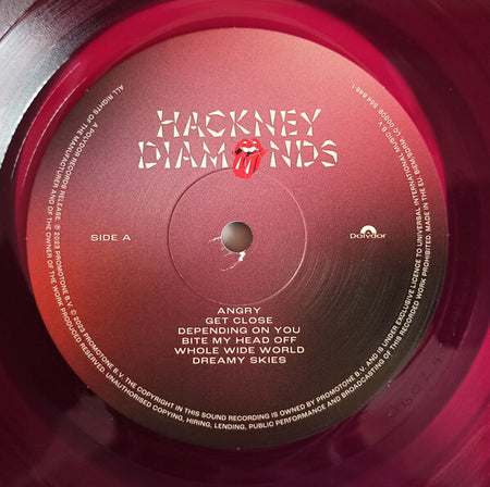 Red vinyl record labeled Hackney Diamonds Side A with track list and Polydor logo