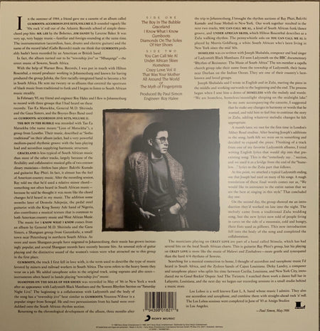 Back cover of a vinyl record with detailed text, track listing, and a black-and-white photo of a man in glasses and a coat.