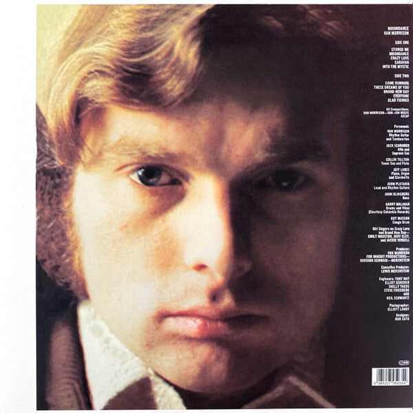 Close-up of a young man's face on a vintage vinyl album cover with song list on the side.