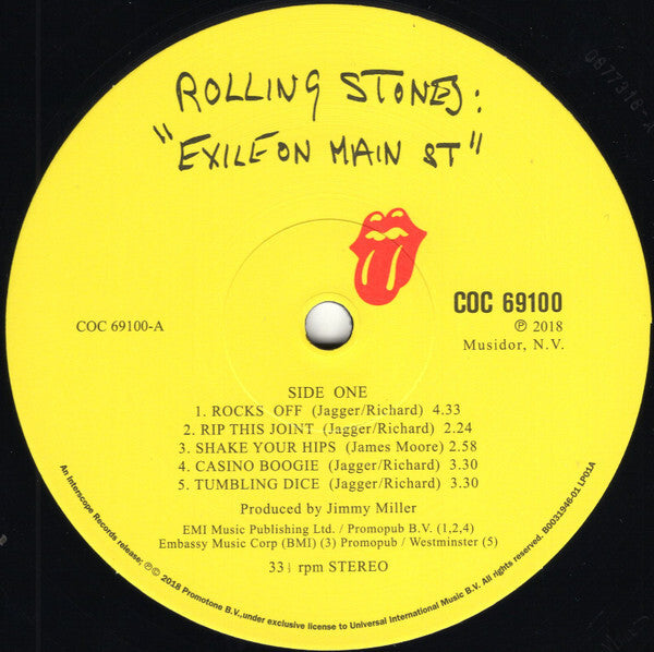 Yellow Rolling Stones Exile on Main St vinyl record label with tongue logo and song list