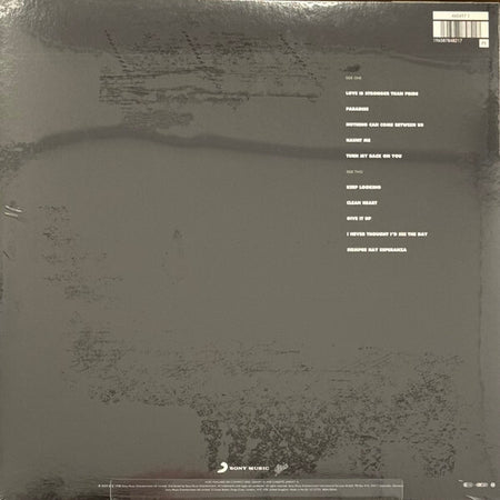 Back cover of a vinyl record with tracklist and Sony Music logo on a dark background.