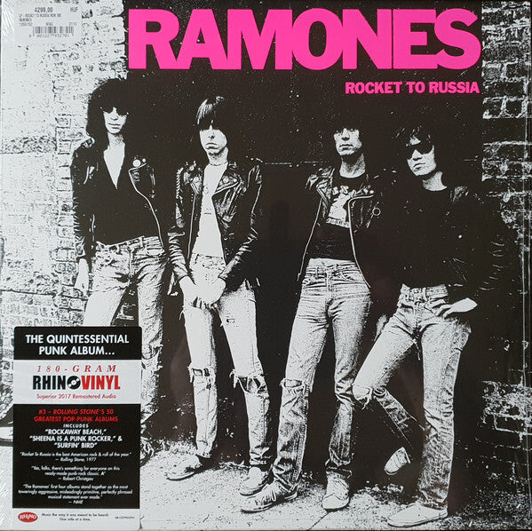 Ramones Rocket to Russia vinyl album cover, punk band in black leather jackets, brick wall background