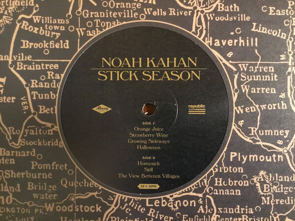 Noah Kahan Stick Season vinyl record with tracklist on vintage map background