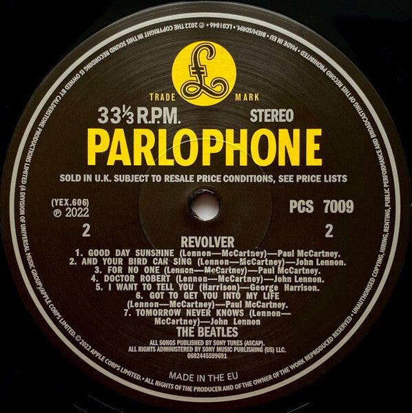 Parlophone vinyl record label for The Beatles Revolver album, tracklist and logo visible