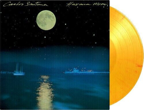 Yellow vinyl record with album cover showing a moonlit ocean and boats at night.