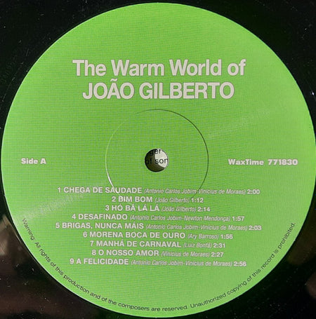Green vinyl record label for 'The Warm World of João Gilberto' with tracklist and song credits.